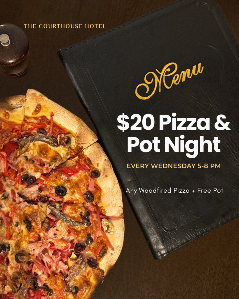 Fresh woodfired pizza with a pot of beer on the table at The Courthouse Hotel Smythesdale.