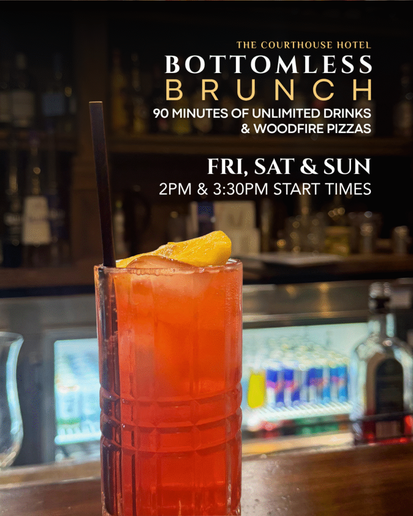 Cocktails and wood-fired pizzas on a rustic table during Bottomless Brunch at The Courthouse Hotel Smythesdale.