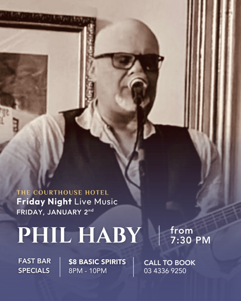 Phil Haby performing live on stage with guitar and microphone at The Courthouse Hotel Smythesdale during Friday Night Live Music.
