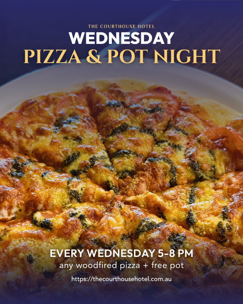 Wood-fired pizza on a table with a pot of beer at The Courthouse Hotel Smythesdale.